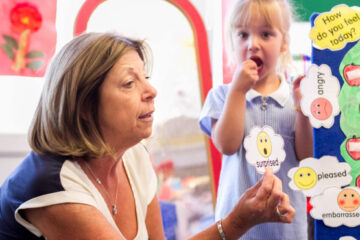 Teacher with school child