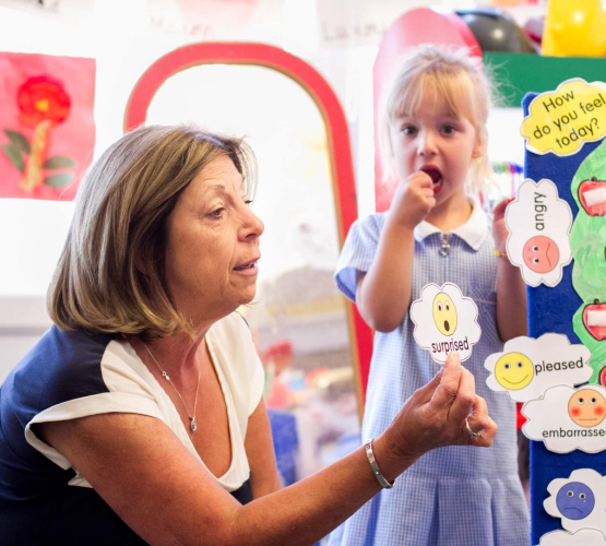 Teacher with school child