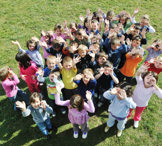 Group of children waving